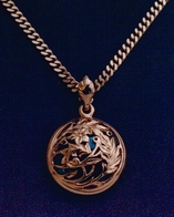 Back of starry night, gold cross pendant